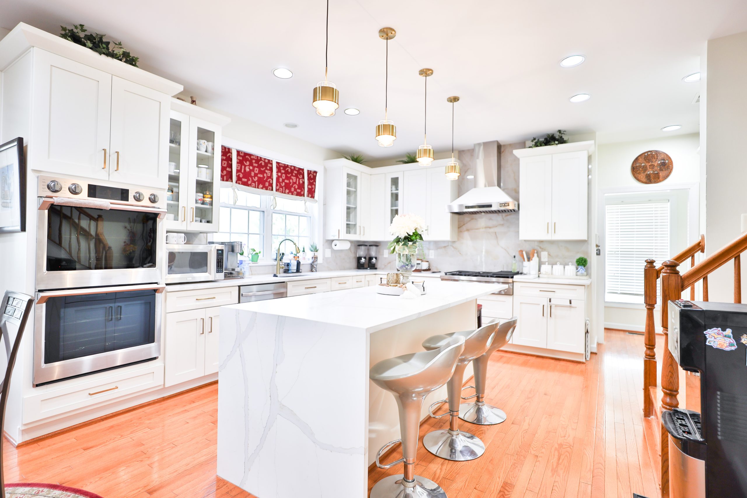 Remodeled open-layout kitchen with pendant lighting and a quartz island in Fairfax VA